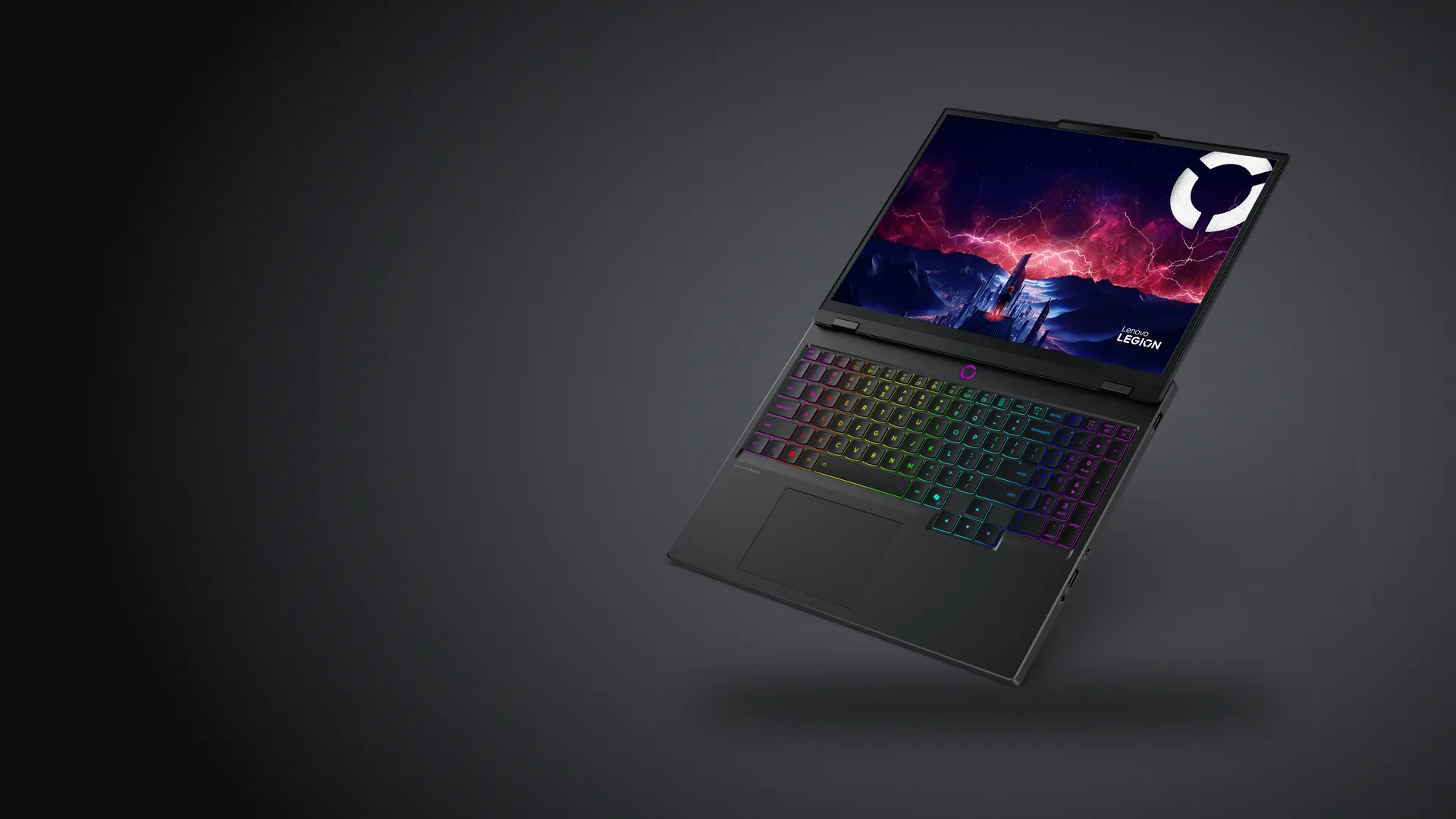 Notebook gamer Lenovo Legion 5 Gen 10 negra, abierta, con el teclado RGB encendido, sobre fondo grafito